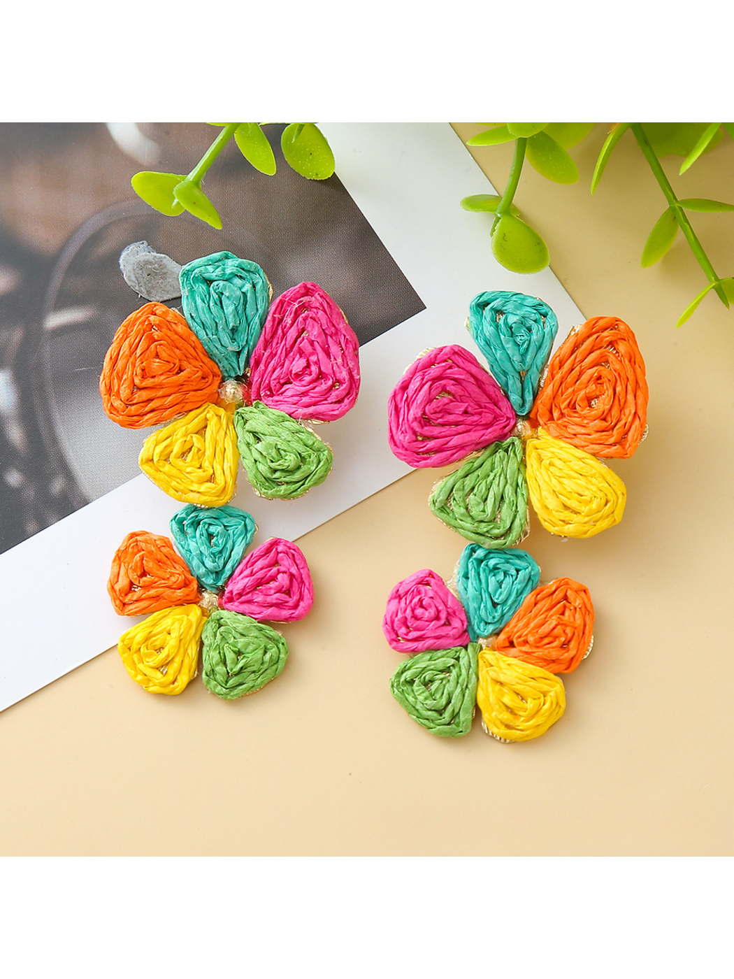 Side view of Earedge raffia drop earrings showing floral pendant details