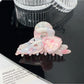 Beau hair claw clip displayed with matching floral accessories