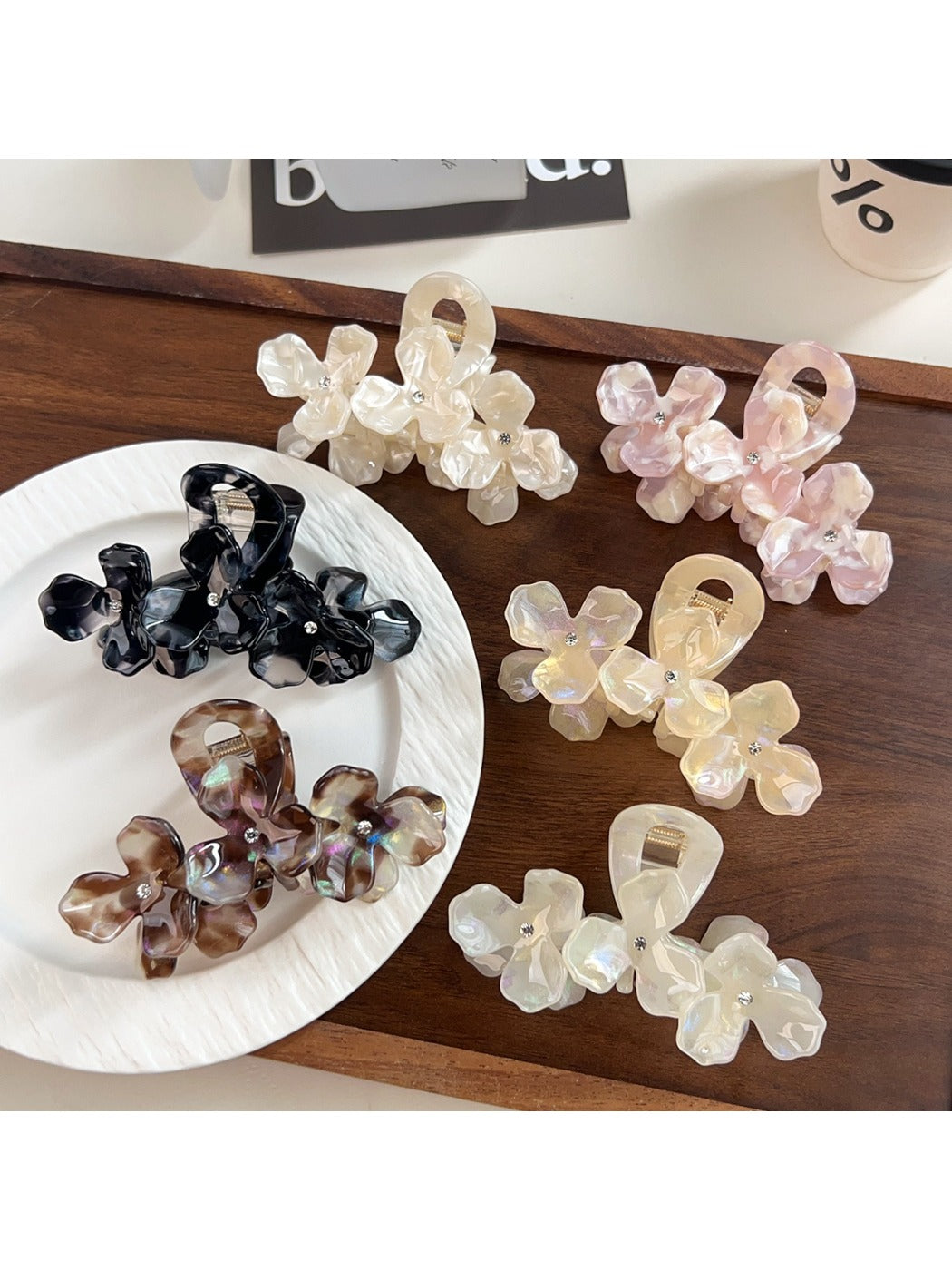 Beau elegant floral hair claw clip in cream and gold tones on white background