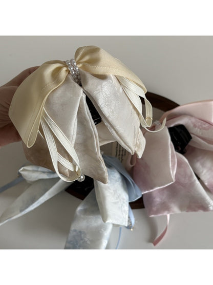 Side view of Beau bow ribbon streamer claw clip highlighting the claw mechanism