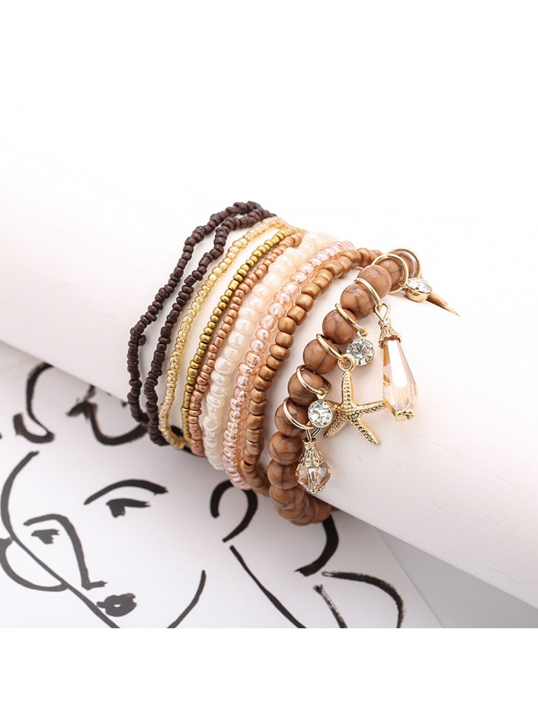 Close-up of Lovra bracelet showing ocean-themed pendant and detailed beadwork