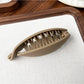 Beau hair clip in matte black shown from the back with clasp visible