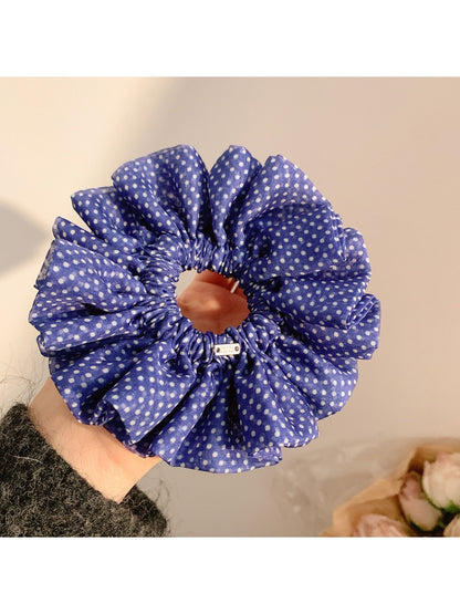 Gifty polka dot scrunchie styled on a wrist with ruffled edges visible