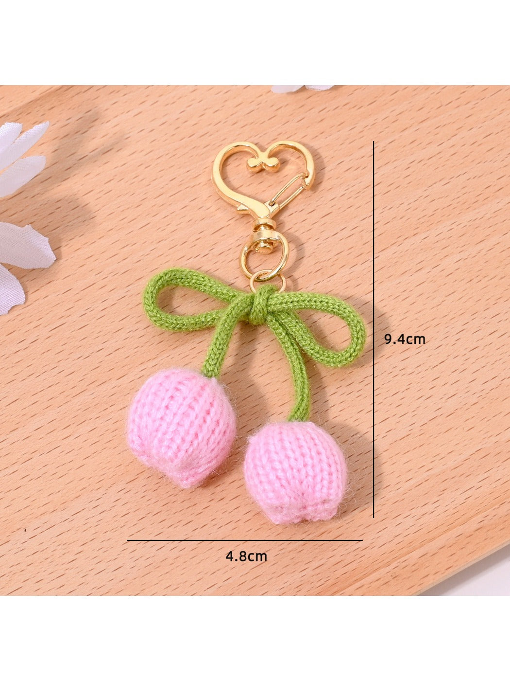 Keypus bouquet and tulip shaped keychains displayed together on a wooden surface