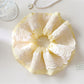 Gifty minimalist scrunchie displayed flat with visible elastic band inside