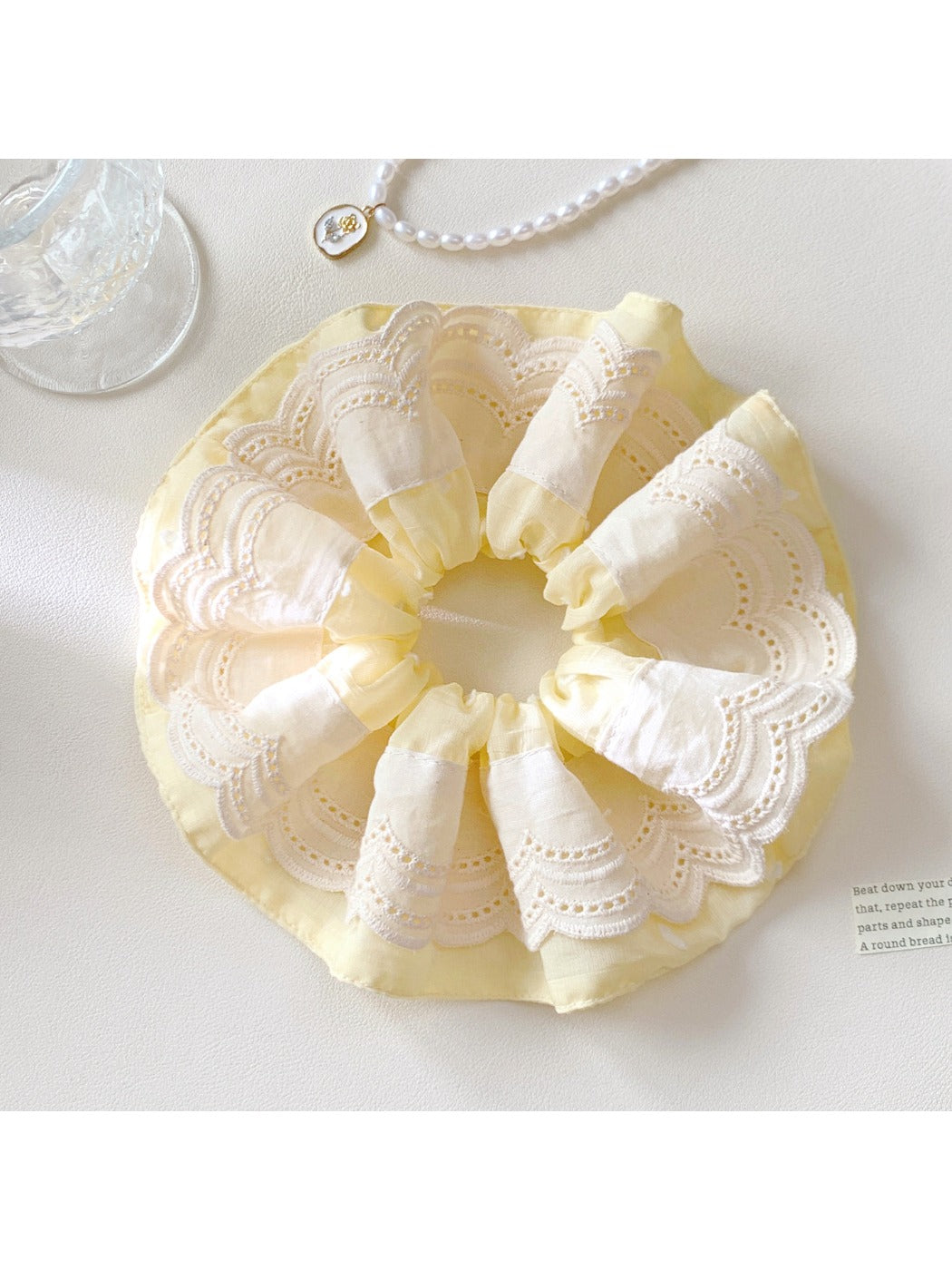 Gifty minimalist scrunchie displayed flat with visible elastic band inside