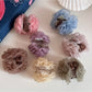 Top view of Beau rose hair clip highlighting petal texture