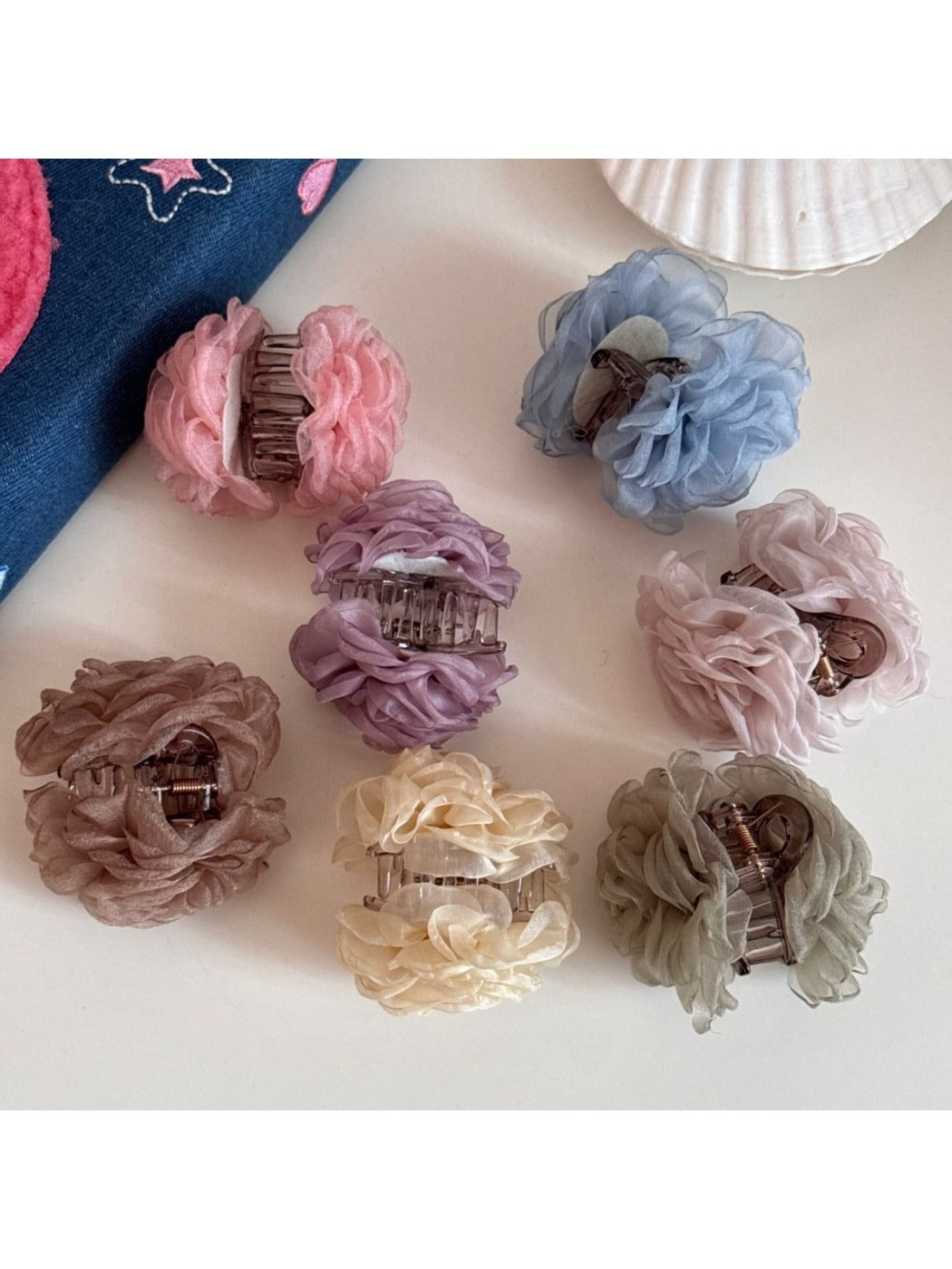 Top view of Beau rose hair clip highlighting petal texture