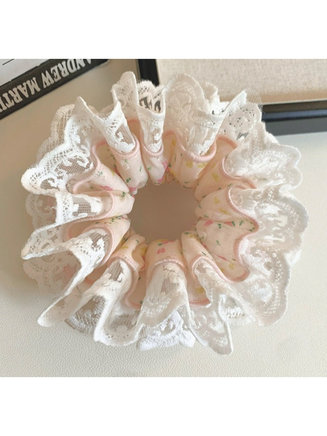 Gifty light pink scrunchie stretched to show elastic band