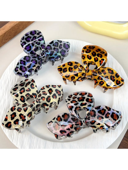 Close-up of Beau hair claw clip showing leopard print and bow shape