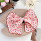 Beau Polka Dot Bow Claw Clip with focus on bow and clasp mechanism