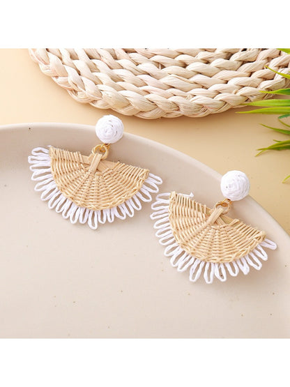 Earedge raffia fan shaped drop earrings laid flat showing natural fibers