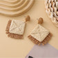 Earedge geometric raffia square earrings in natural light highlighting woven details