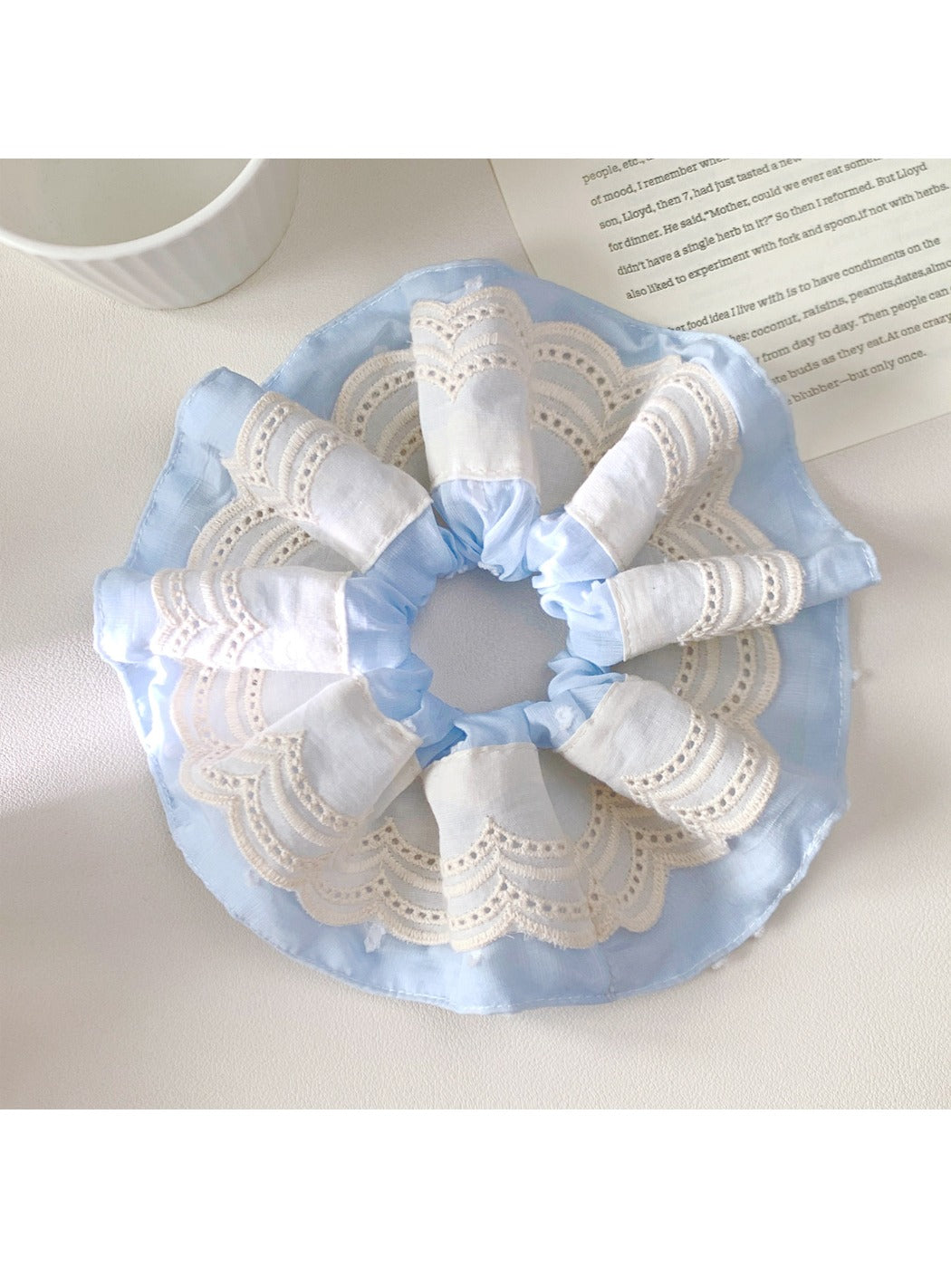 Gifty scrunchie paired with casual outfit, highlighting its neutral color palette