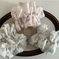 Close-up of Gifty Sweet Lace Tiny Floral Scrunchie with delicate lace and small floral pattern