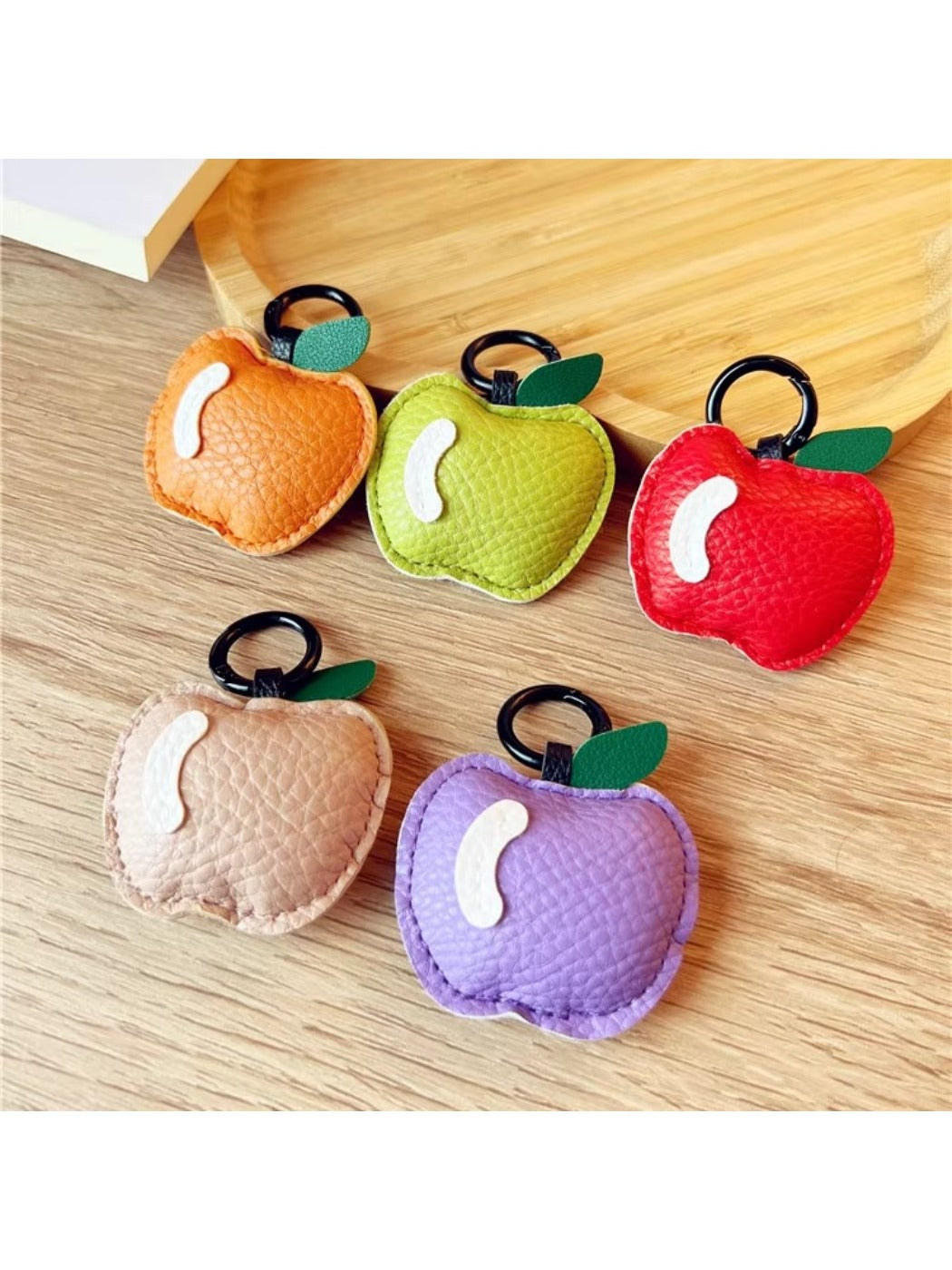 Small apple shaped keychain with red enamel finish and silver keyring