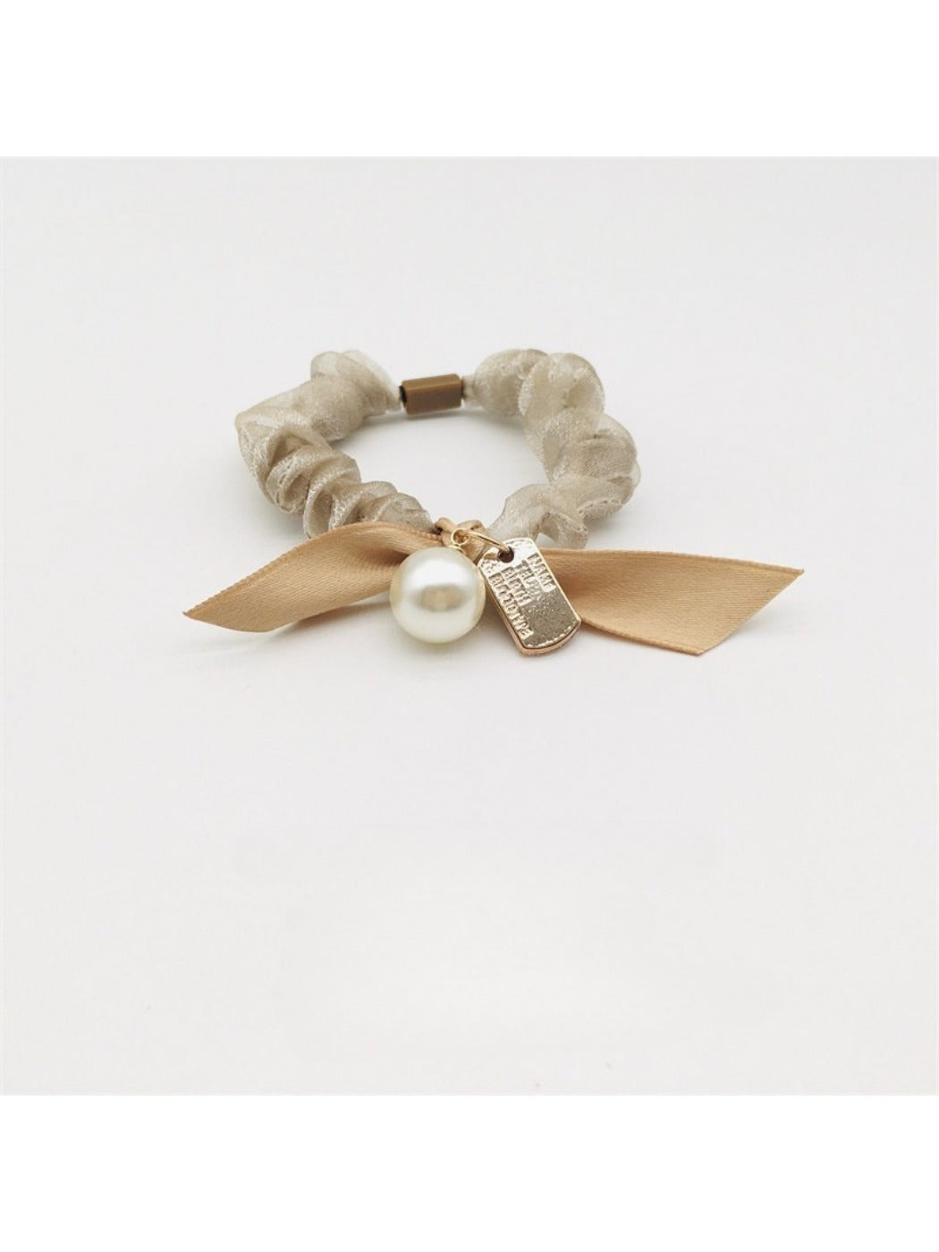 Close-up of Gifty Sweet Bow Embellished Hair Tie with pink fabric and pearl accents