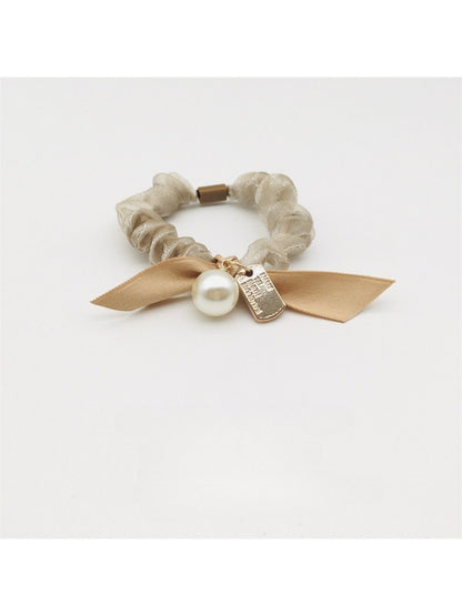 Close-up of Gifty Sweet Bow Embellished Hair Tie with pink fabric and pearl accents