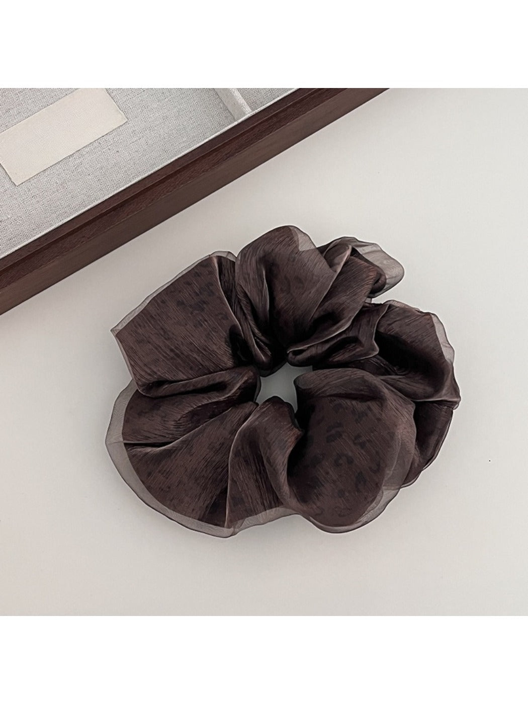 Gifty leopard print tulle scrunchie displayed on a white background