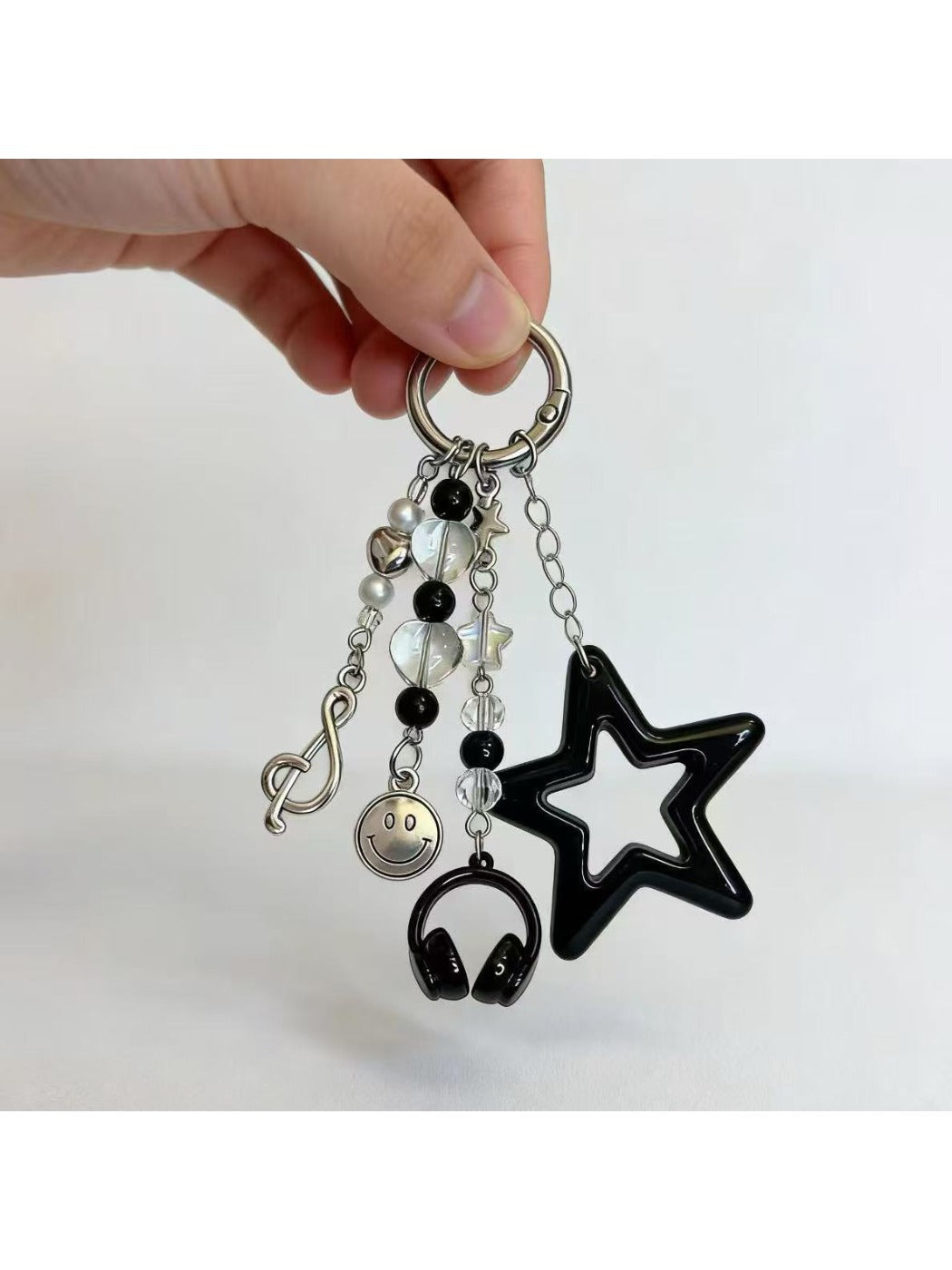 Star smiley face keychain displayed on a white background