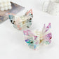 Side view of Beau double layer hollow bow shaped claw clip highlighting bow design