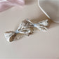 Beau printed bow banana clip displayed on a white surface with natural lighting