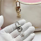 Side view of Keypus flower keychain showing detailed petal design and gold clasp