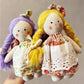 Back view of Keypus cartoon doll bag charm highlighting the keyring attachment