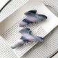 Beau hair claw clip open to display spring mechanism and teeth