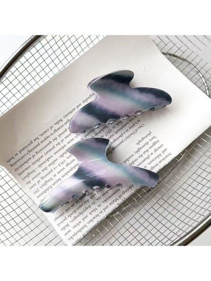 Beau hair claw clip open to display spring mechanism and teeth