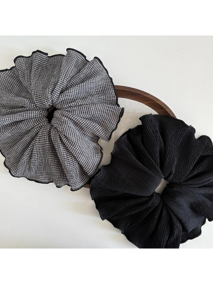 Side view of Gifty vintage plaid fabric scrunchie showing gathered fabric texture