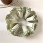 Green double layer scrunchie displayed on a white background showing its full shape