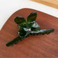 Beau minimalist hair claw clip displayed on fabric background