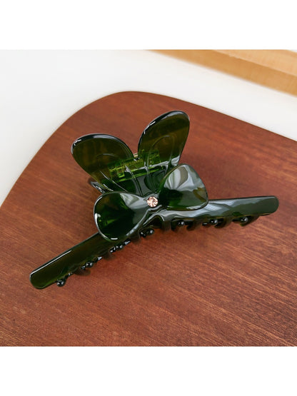 Beau minimalist hair claw clip displayed on fabric background