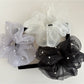 Close-up of Gifty elegant chic tulle scrunchie in soft beige color