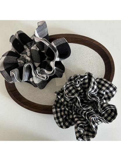 Black and white checkered vintage scrunchie on a white background