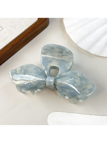 Beau iridescent bow hair claw clip reflecting pastel colors