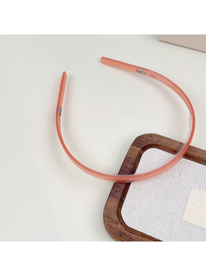 Gifty headband displayed on white background highlighting solid color design