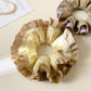 Vintage yellow ruffle scrunchie displayed on a white background