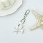 Starfish shaped pendant keychain with a metallic finish