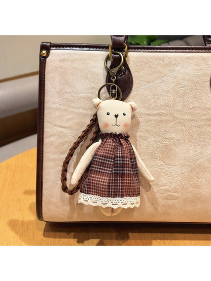 Back view of cartoon bear charm keychain showing plain brown surface