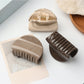 Close-up of Beau half circle hair clip showing smooth matte gold finish