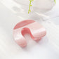 Beau arched hair claw clip open showing inner teeth and spring detail