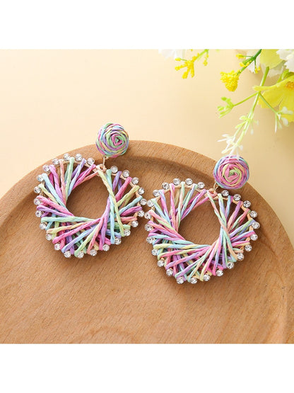Side view of silver heart-shaped drop earring with smooth finish