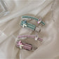 Close-up of Beau chic flat hair clip showing smooth surface and rounded edges