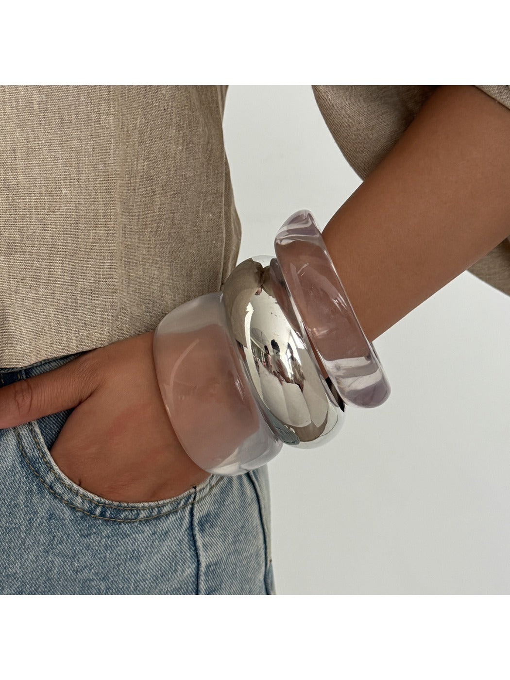 Close-up of Lovra wide band bangle bracelet showing smooth finish