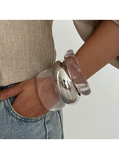 Close-up of Lovra wide band bangle bracelet showing smooth finish
