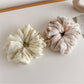 Side view of Gifty printed scrunchie showing gathered fabric texture
