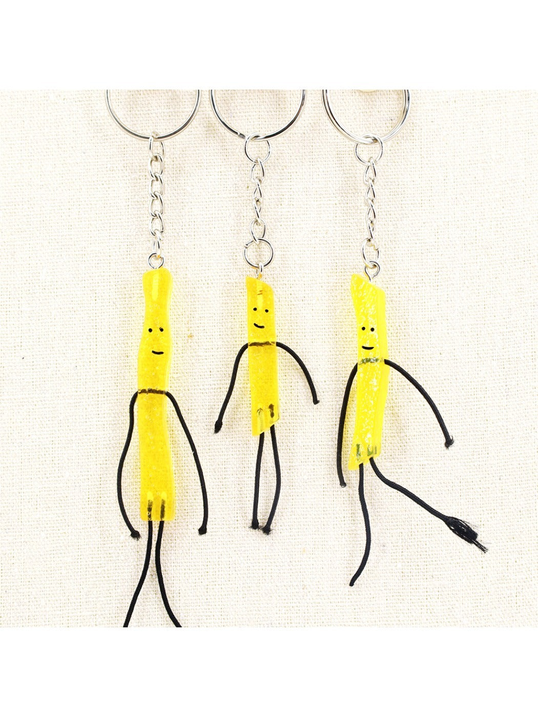 Close-up of mini French fries keychain showing detailed fries and red container