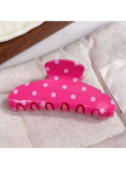 Beau polka dot half circle claw clip with metal spring mechanism visible